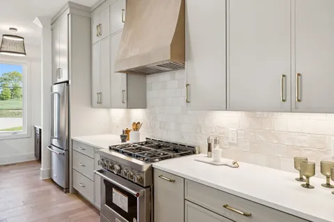 a bedroom with a bed and a potted plant