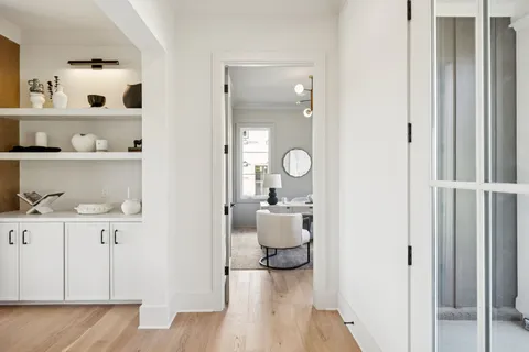 a living room with kitchen island furniture and a window