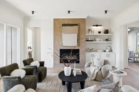 a large kitchen with a table and chairs