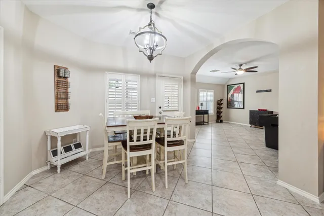 a dining room with furniture and window