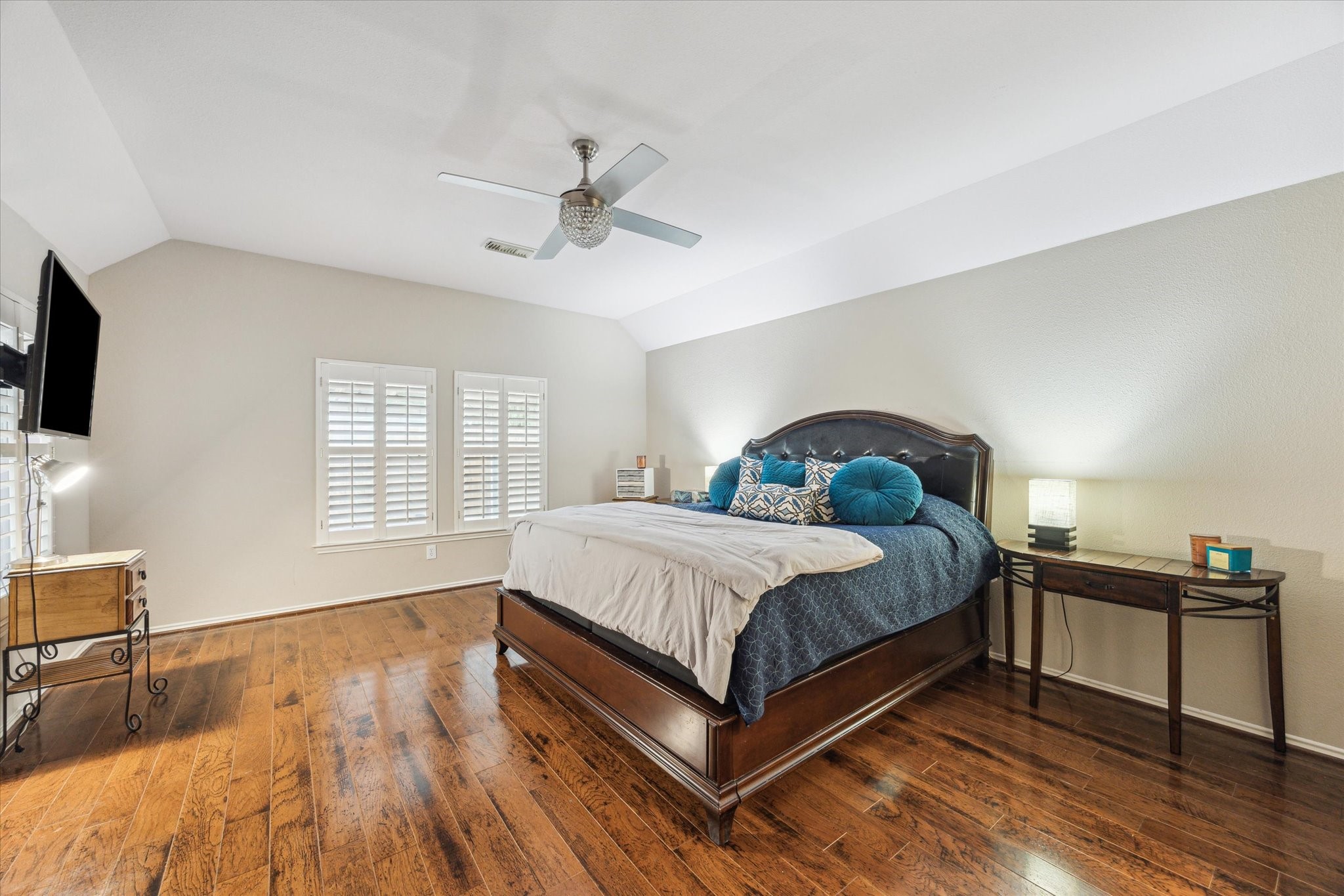 26311 Shady Walk Lane Katy, TX 77494 - Photo 14 of 25 a spacious bedroom with a bed and wooden floor