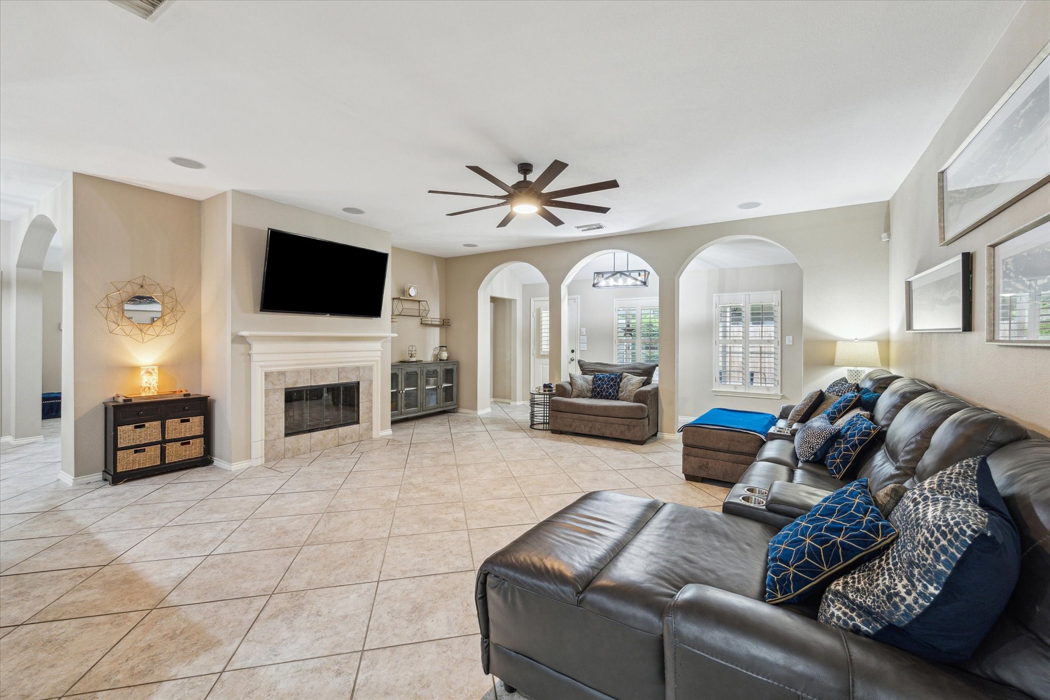 26311 Shady Walk Lane Katy, TX 77494 - Photo 6 of 25 a living room with furniture a fireplace and a flat screen tv