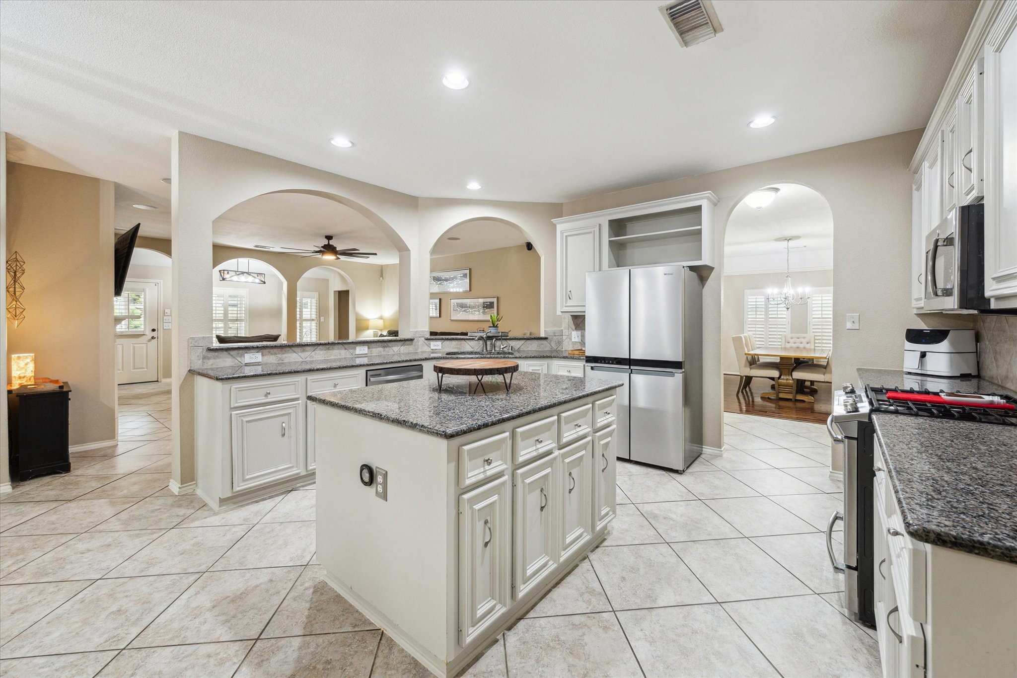 26311 Shady Walk Lane Katy, TX 77494 - Photo 9 of 25 a kitchen with stainless steel appliances granite countertop a sink and cabinets