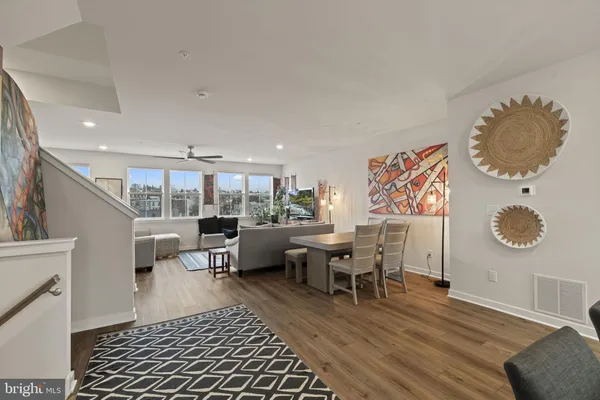 a living room with furniture and a rug