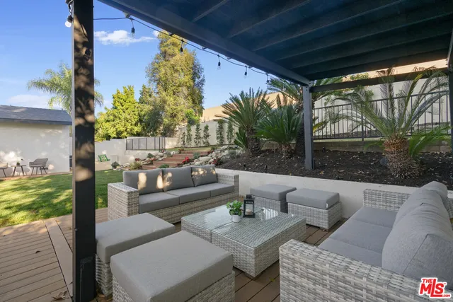 a outdoor living space with furniture and garden view