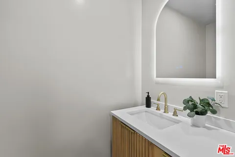 a room with gym equipment and white walls