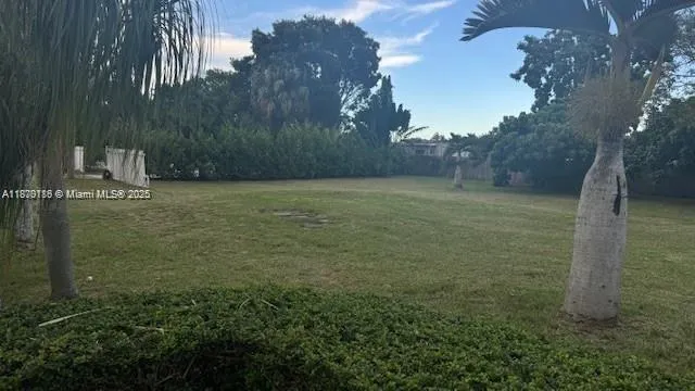a backyard of a house with lots of green space