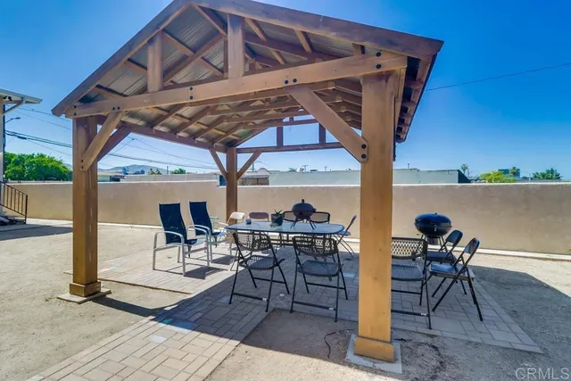 a view of a chairs and table in the patio