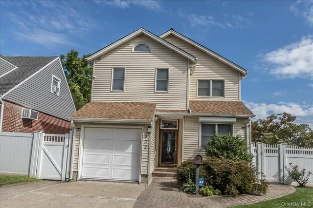 a view of a house with a yard and plants
