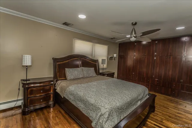 a bathroom with a granite countertop sink a toilet and a mirror