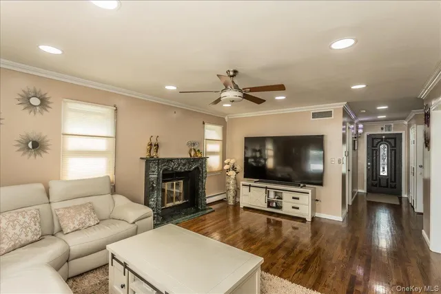 a living room with furniture a chandelier and a chandelier