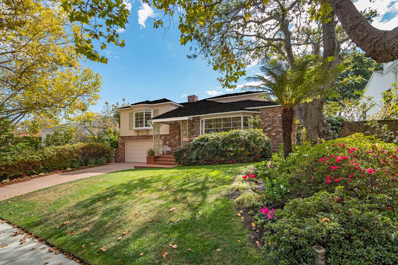 625 Parrott Drive San Mateo, CA 94402 - Photo 1 of 22 a view of a house with a big yard and potted plants and large trees