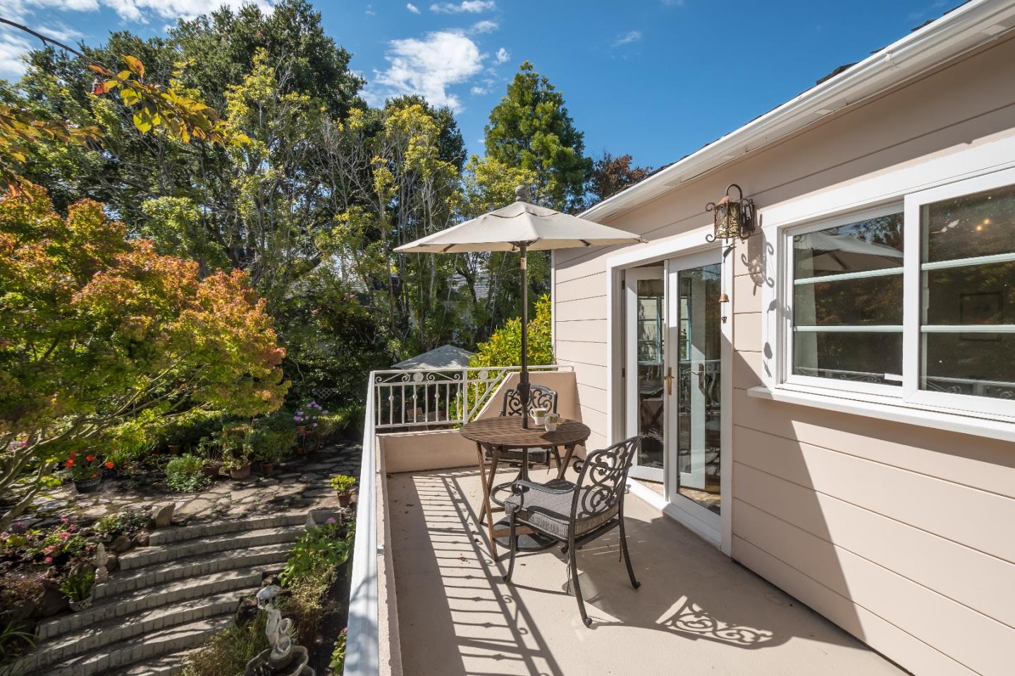 625 Parrott Drive San Mateo, CA 94402 - Photo 18 of 22 a view of a patio with table and chairs with wooden floor and fence