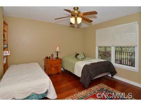 3512 Chesnee Road Rutherfordton, NC 28139 - Photo 12 of 16 a bedroom with a bed and a chandelier