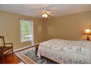 3512 Chesnee Road Rutherfordton, NC 28139 - Photo 13 of 16 a bedroom with a bed chandelier and a window