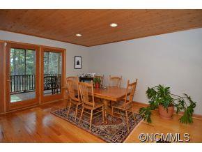 3512 Chesnee Road Rutherfordton, NC 28139 - Photo 15 of 16 a view of a dining room with furniture large windows and wooden floor