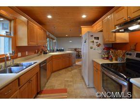3512 Chesnee Road Rutherfordton, NC 28139 - Photo 6 of 16 a kitchen with stainless steel appliances granite countertop a sink a stove and a refrigerator