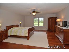 3512 Chesnee Road Rutherfordton, NC 28139 - Photo 10 of 16 a bedroom with a bed and a chandelier