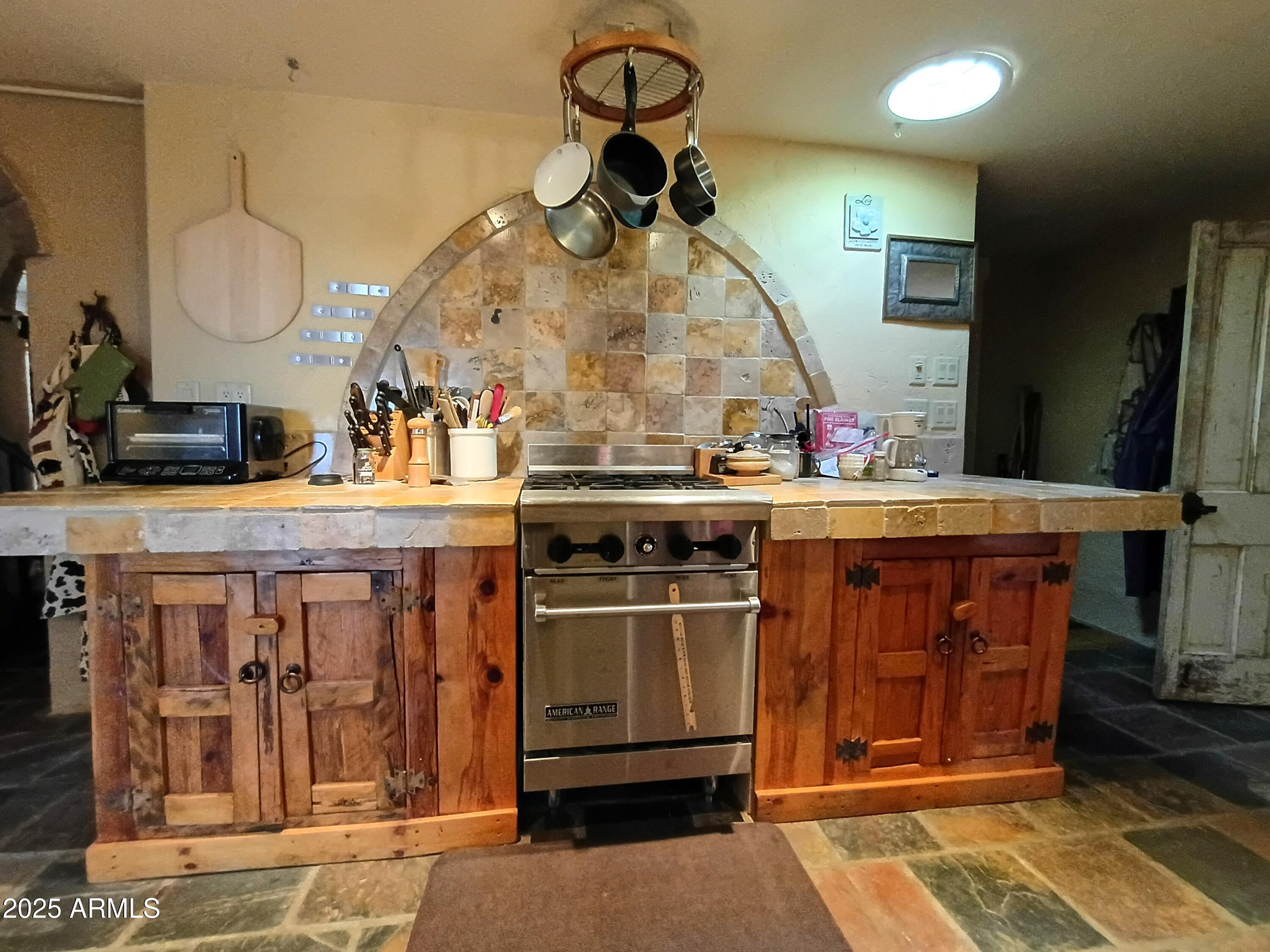 2985 North Federal Mines Road Dewey, AZ 86327 - Photo 12 of 30 a kitchen with a sink a stove and a wooden floor