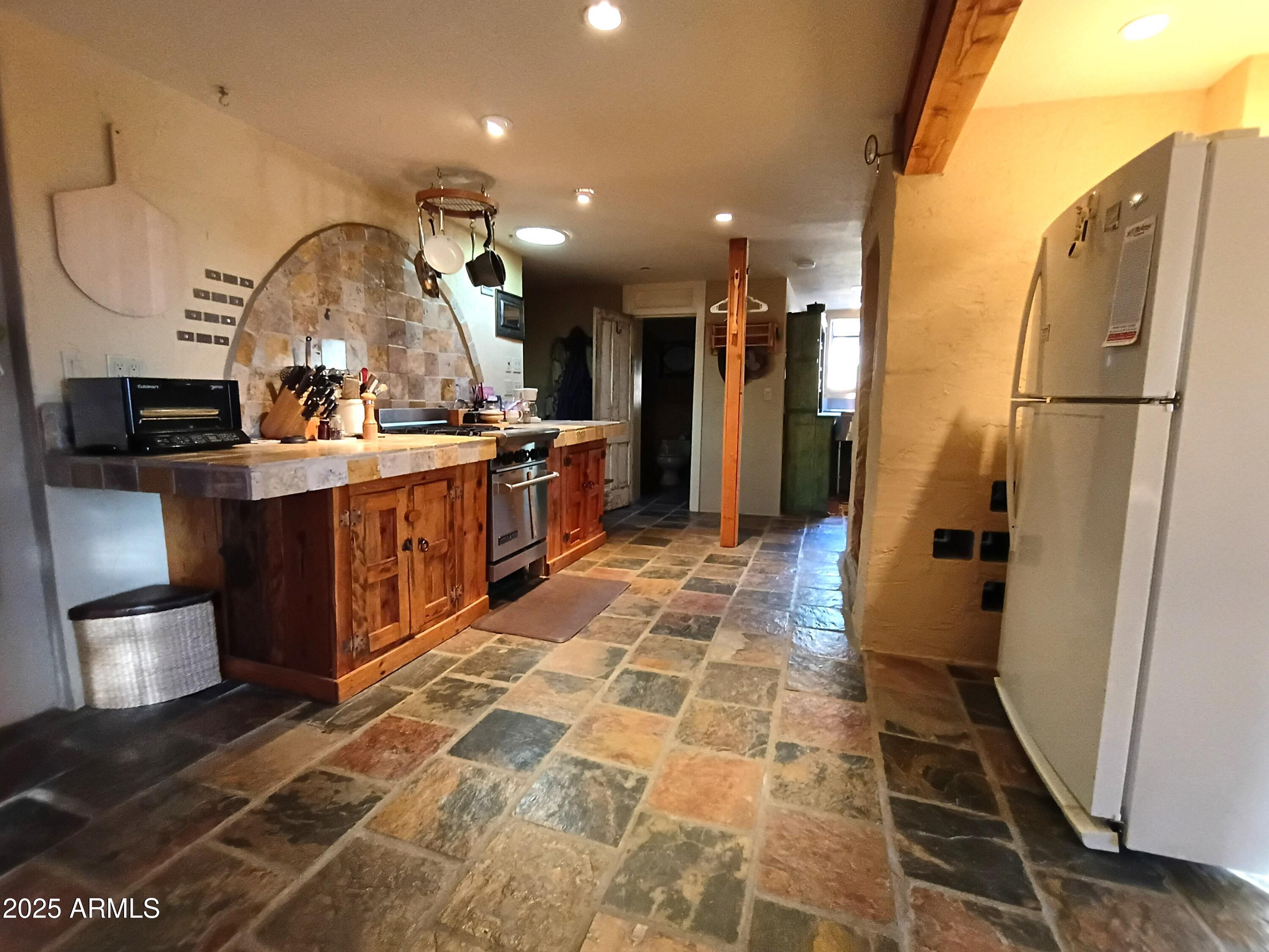 2985 North Federal Mines Road Dewey, AZ 86327 - Photo 10 of 30 a large bathroom with a sink and a large mirror