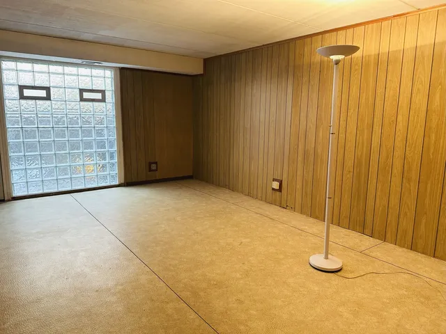 a view of an empty room with windows