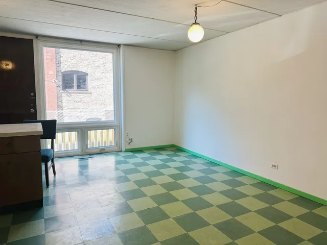 a view of an empty room and window