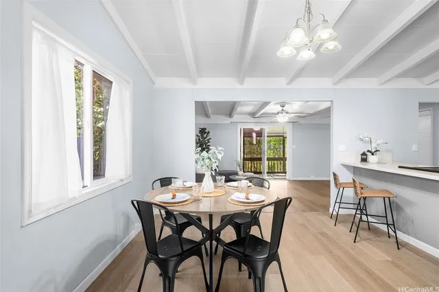 a view of a dining room with furniture window and outside view