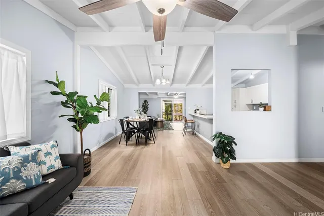 a view of a work space with furniture and a potted plant