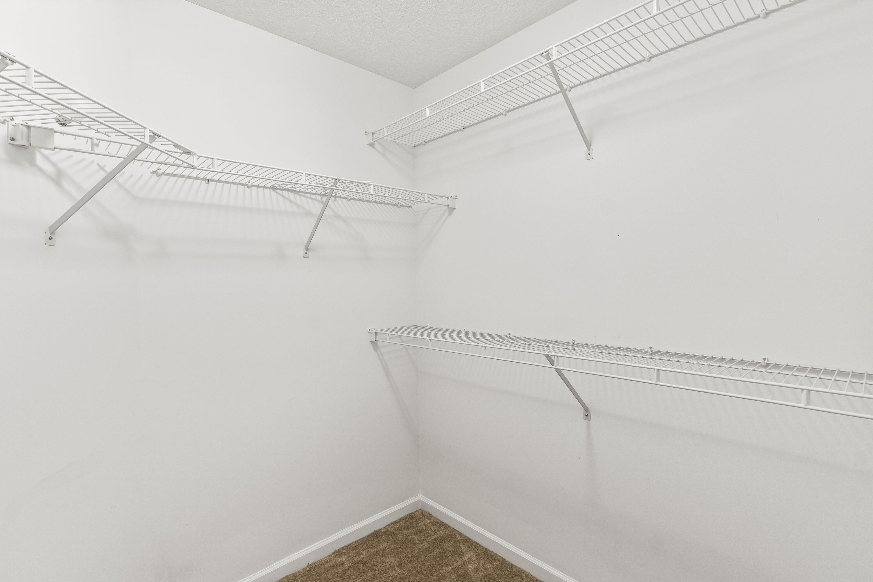 1951 Brandywine Road, Unit 207 West Palm Beach, FL 33409 - Photo 11 of 45 a view of a room with racks on the wall