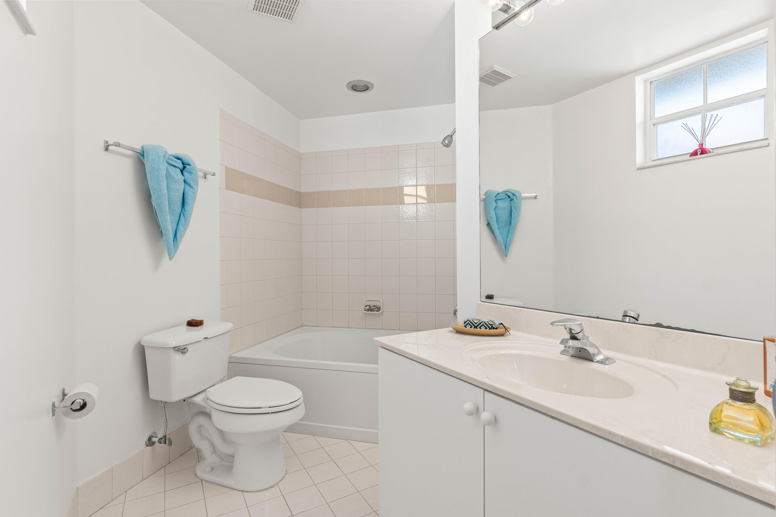 1951 Brandywine Road, Unit 207 West Palm Beach, FL 33409 - Photo 13 of 45 a bathroom with a sink a toilet and shower
