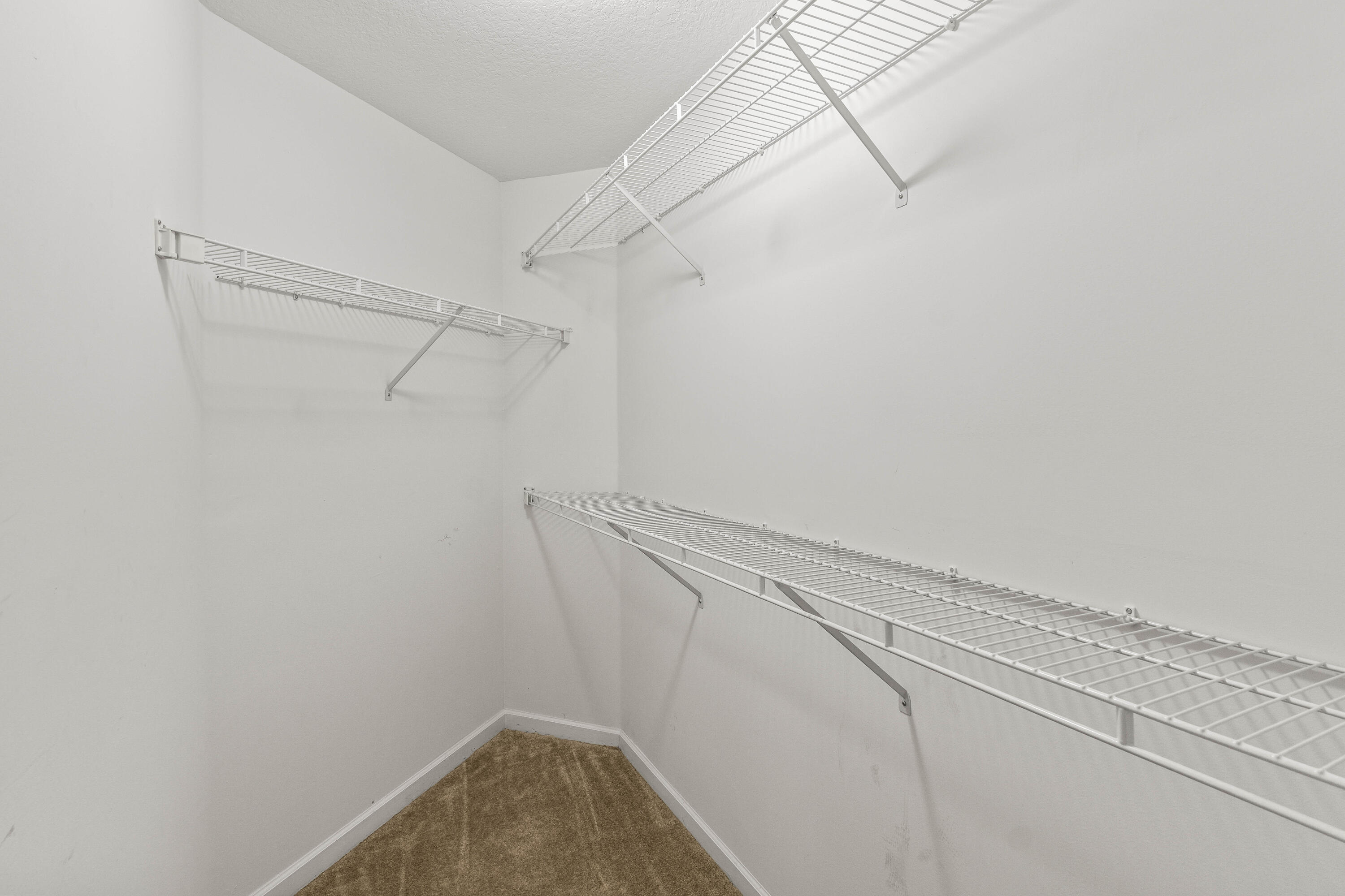 1951 Brandywine Road, Unit 207 West Palm Beach, FL 33409 - Photo 17 of 45 a view of a room with racks on the wall