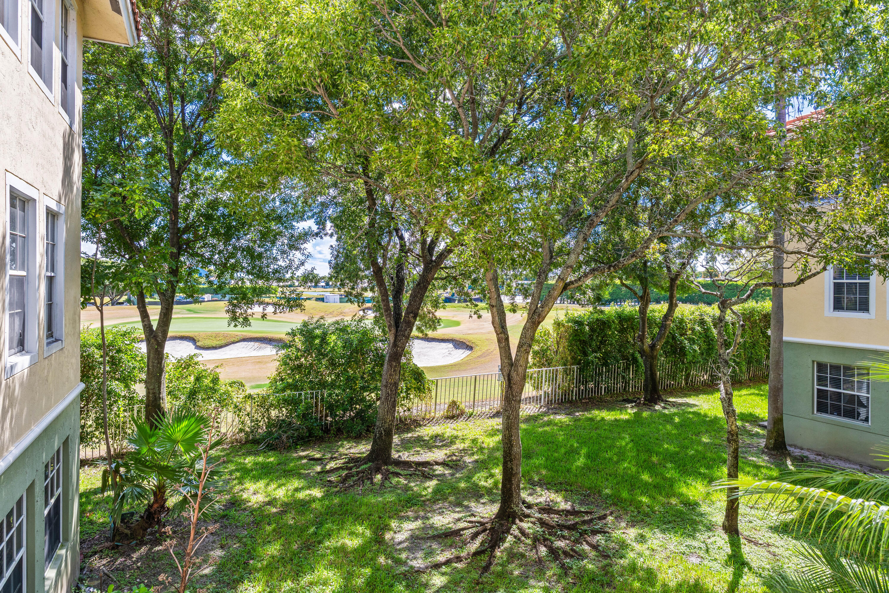 1951 Brandywine Road, Unit 207 West Palm Beach, FL 33409 - Photo 23 of 45 a backyard of a house with lots of green space