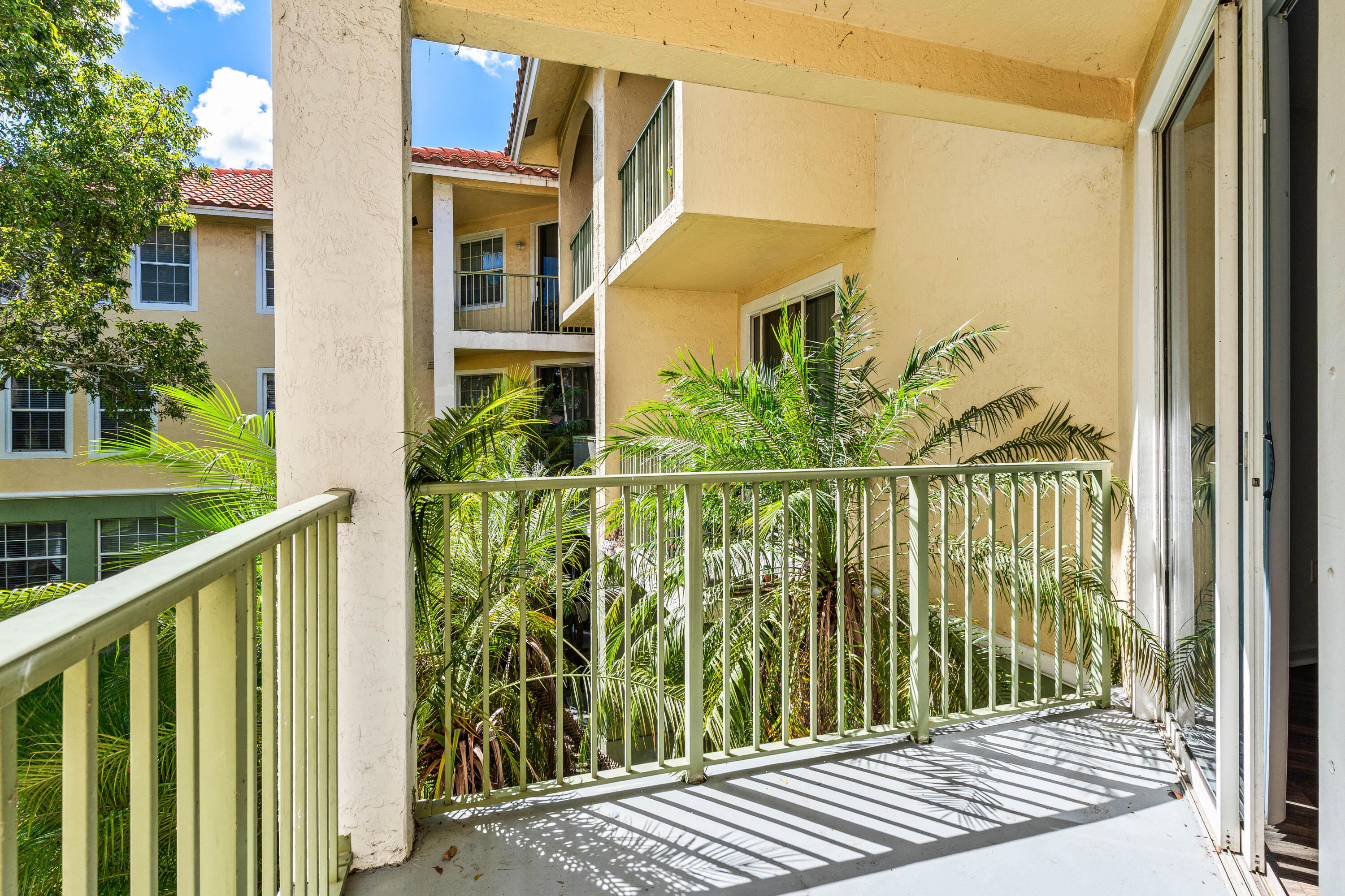 1951 Brandywine Road, Unit 207 West Palm Beach, FL 33409 - Photo 25 of 45 a view of a balcony with wooden floor