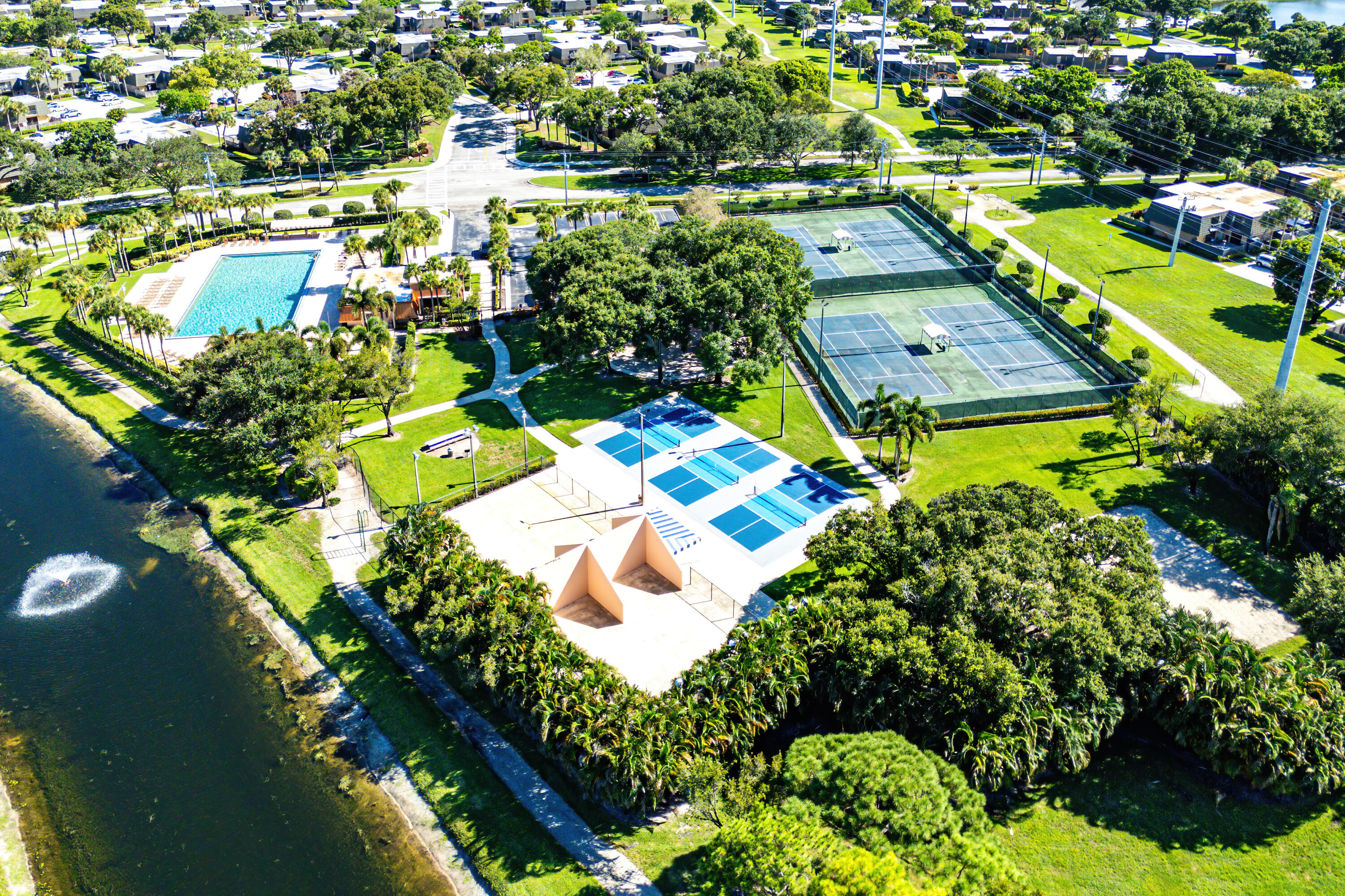 1951 Brandywine Road, Unit 207 West Palm Beach, FL 33409 - Photo 32 of 45 an aerial view of a house with a swimming pool yard and outdoor seating