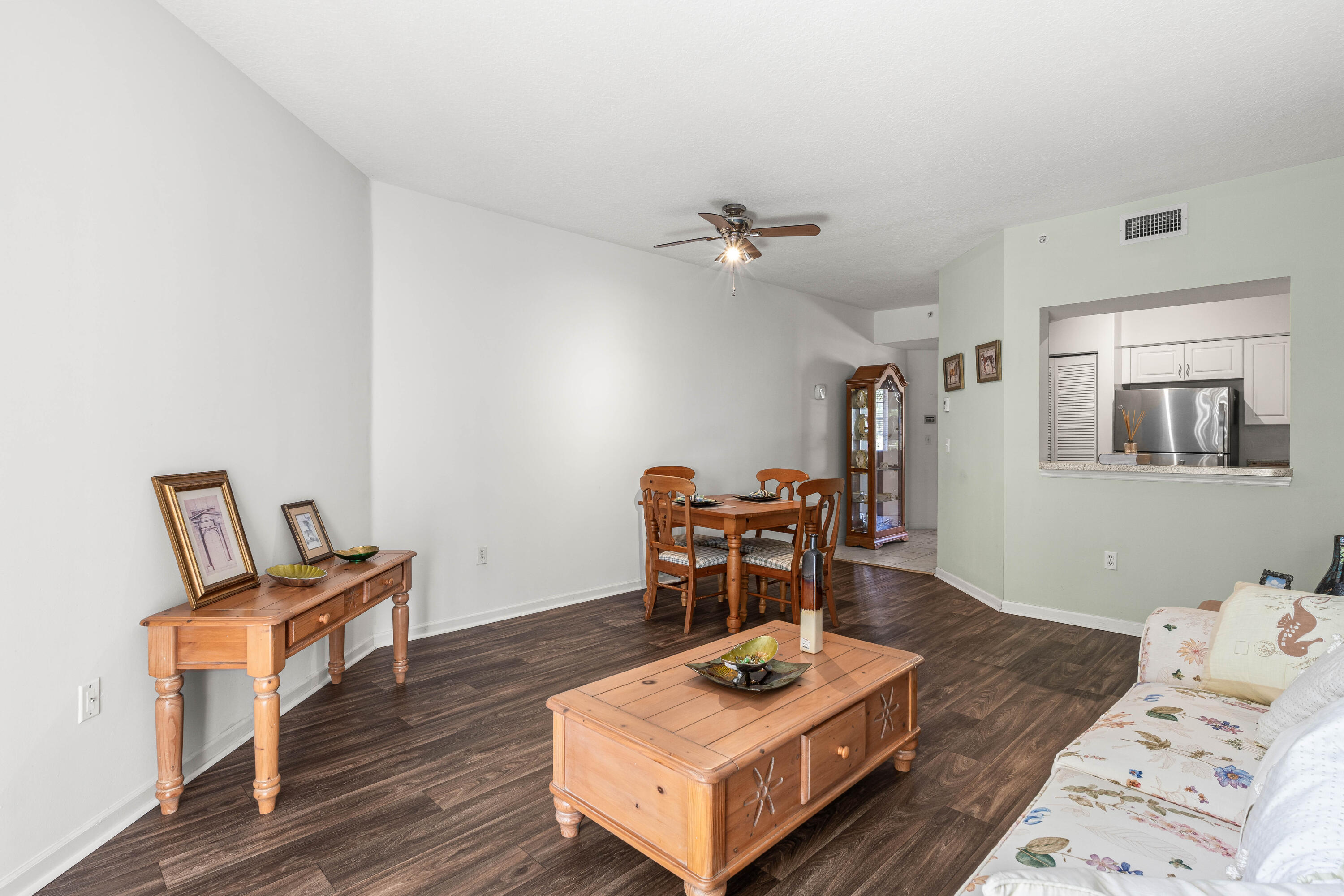 1951 Brandywine Road, Unit 207 West Palm Beach, FL 33409 - Photo 7 of 45 a living room with furniture and a wooden floor
