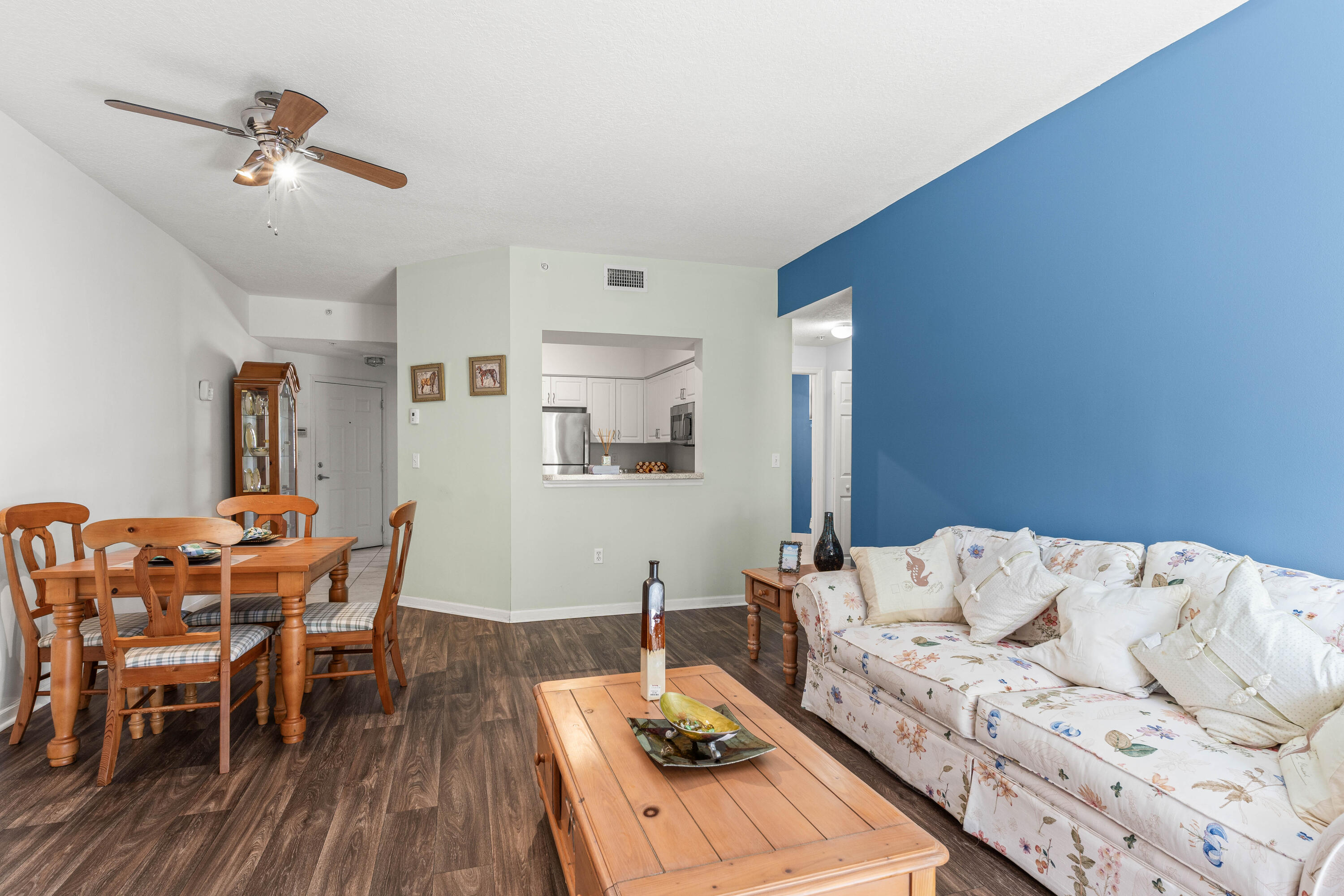 1951 Brandywine Road, Unit 207 West Palm Beach, FL 33409 - Photo 8 of 45 a living room with furniture and wooden floor