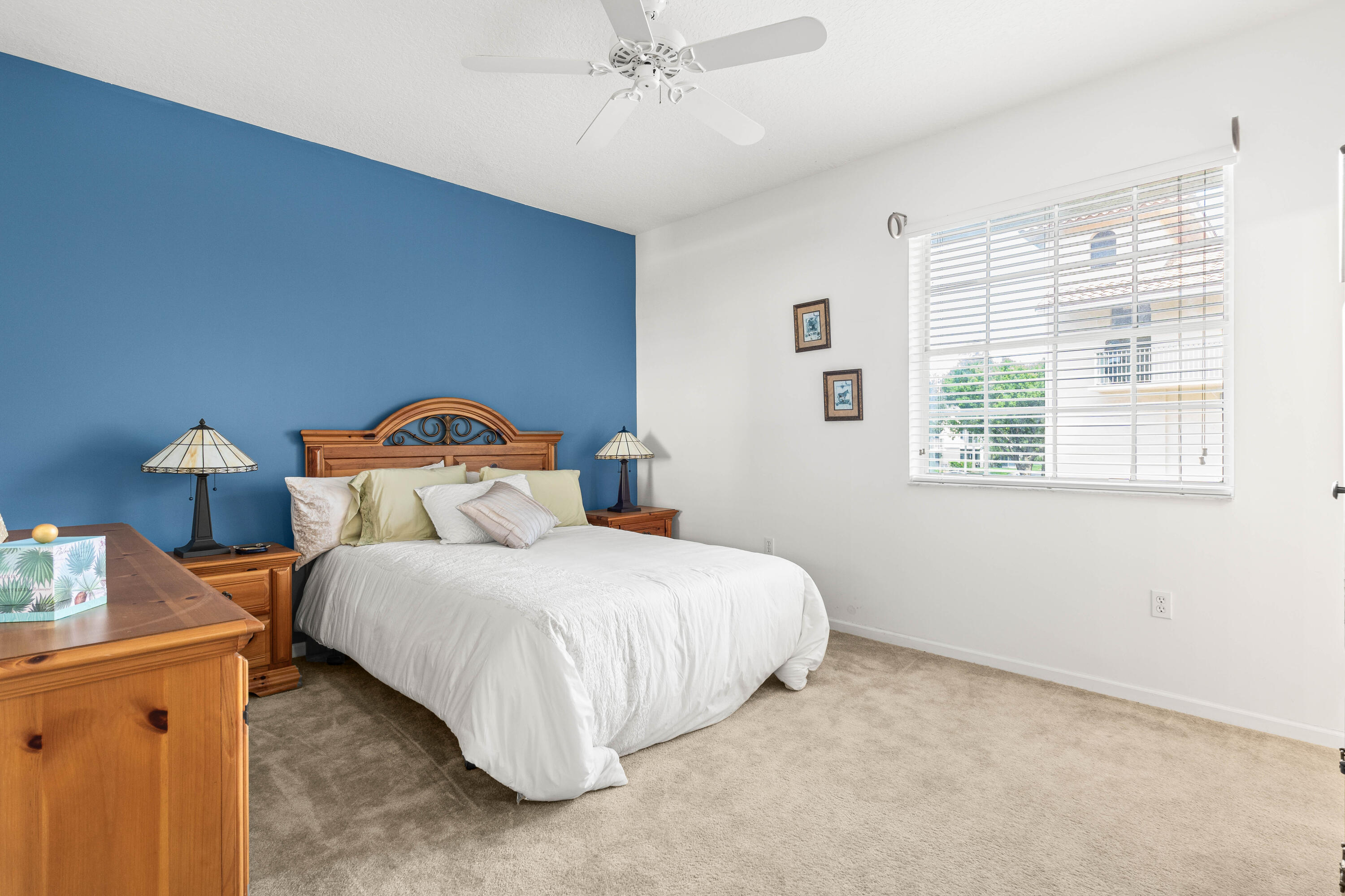 1951 Brandywine Road, Unit 207 West Palm Beach, FL 33409 - Photo 9 of 45 a bedroom with a bed and a window