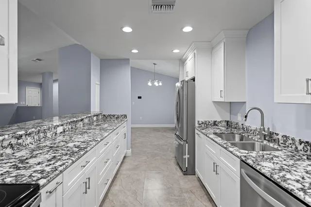 en empty room with windows and entrance