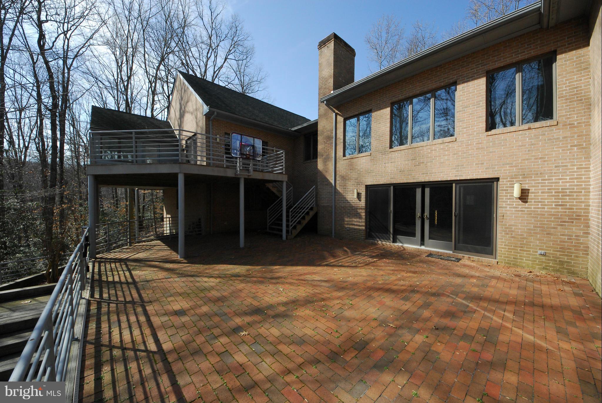 1629 Wyatts Ridge Road Crownsville, MD 21032 - Photo 12 of 28 Brick patio overlooks the free-form pool