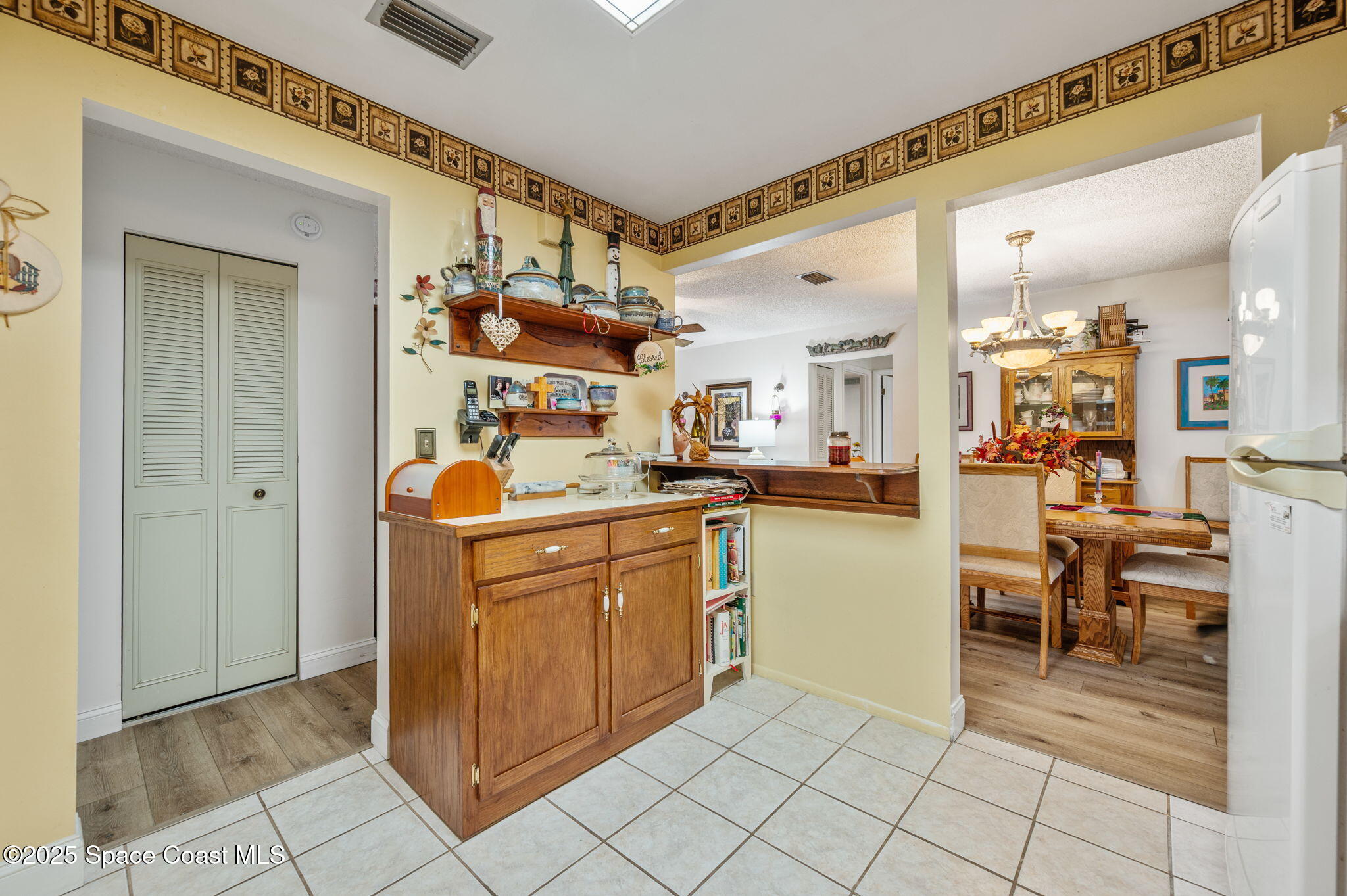 5220 Holden Road Cocoa, FL 32927 - Photo 20 of 31 a kitchen with stainless steel appliances granite countertop a refrigerator and a sink