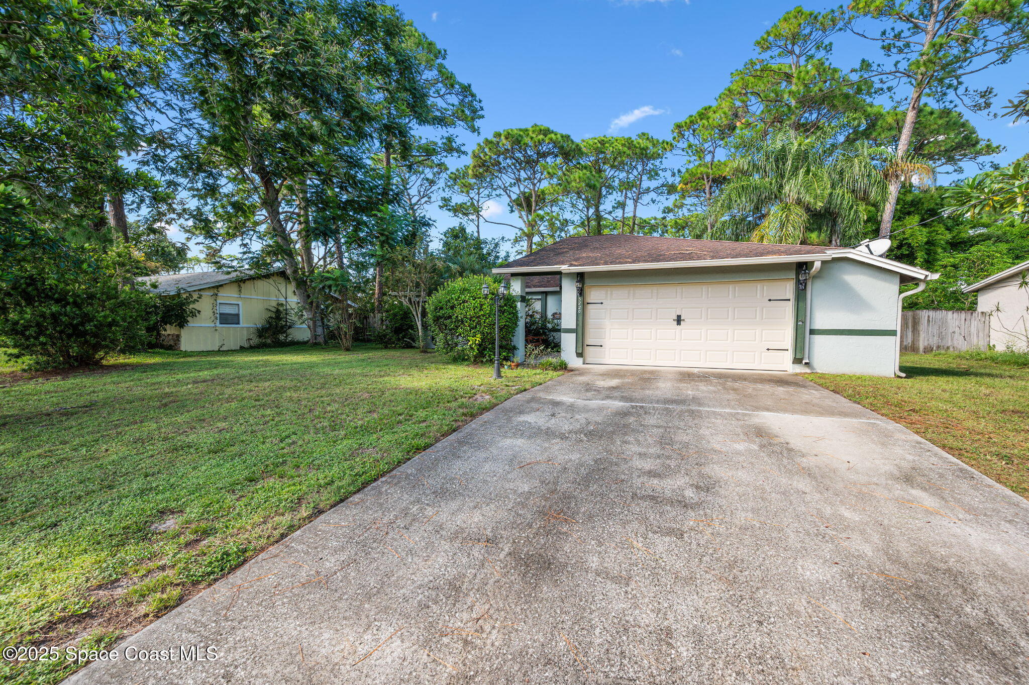5220 Holden Road Cocoa, FL 32927 - Photo 2 of 31 a front view of house with yard and green space