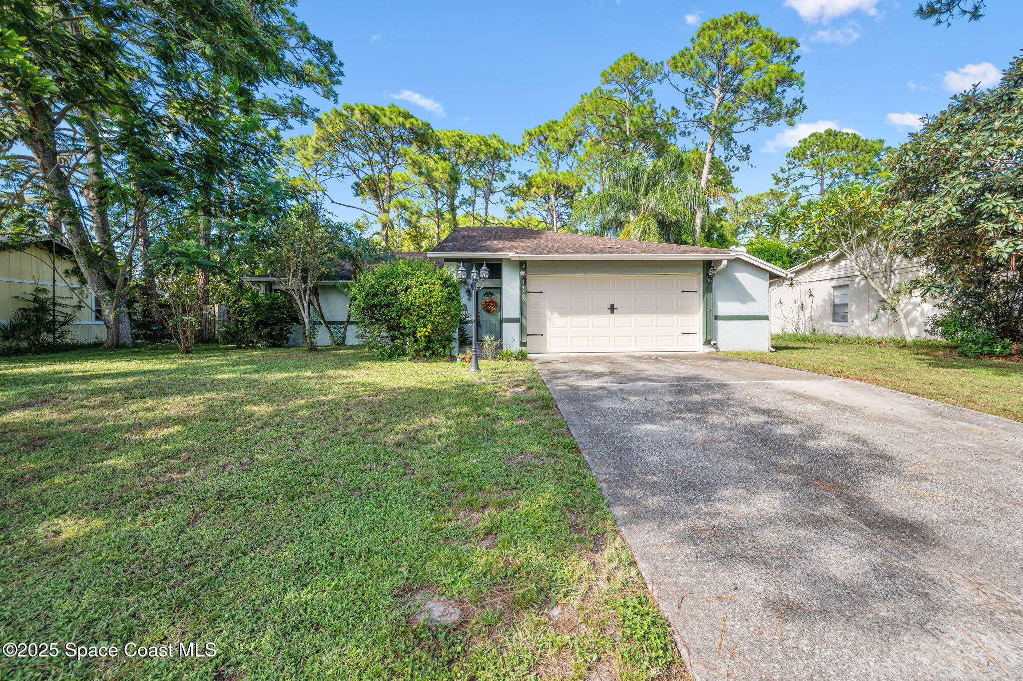 5220 Holden Road Cocoa, FL 32927 - Photo 4 of 31 a front view of house with yard and green space