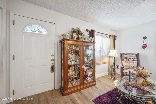a view of a livingroom with furniture and hardwood floor