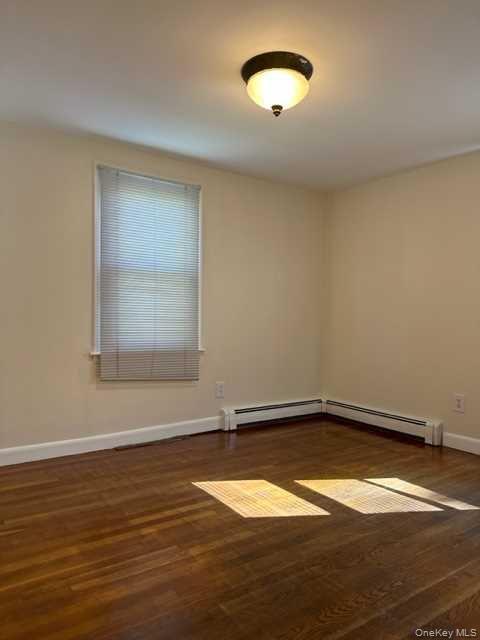 131 Spackenkill Road Poughkeepsie, NY 12603 - Photo 6 of 14 an empty room with a window