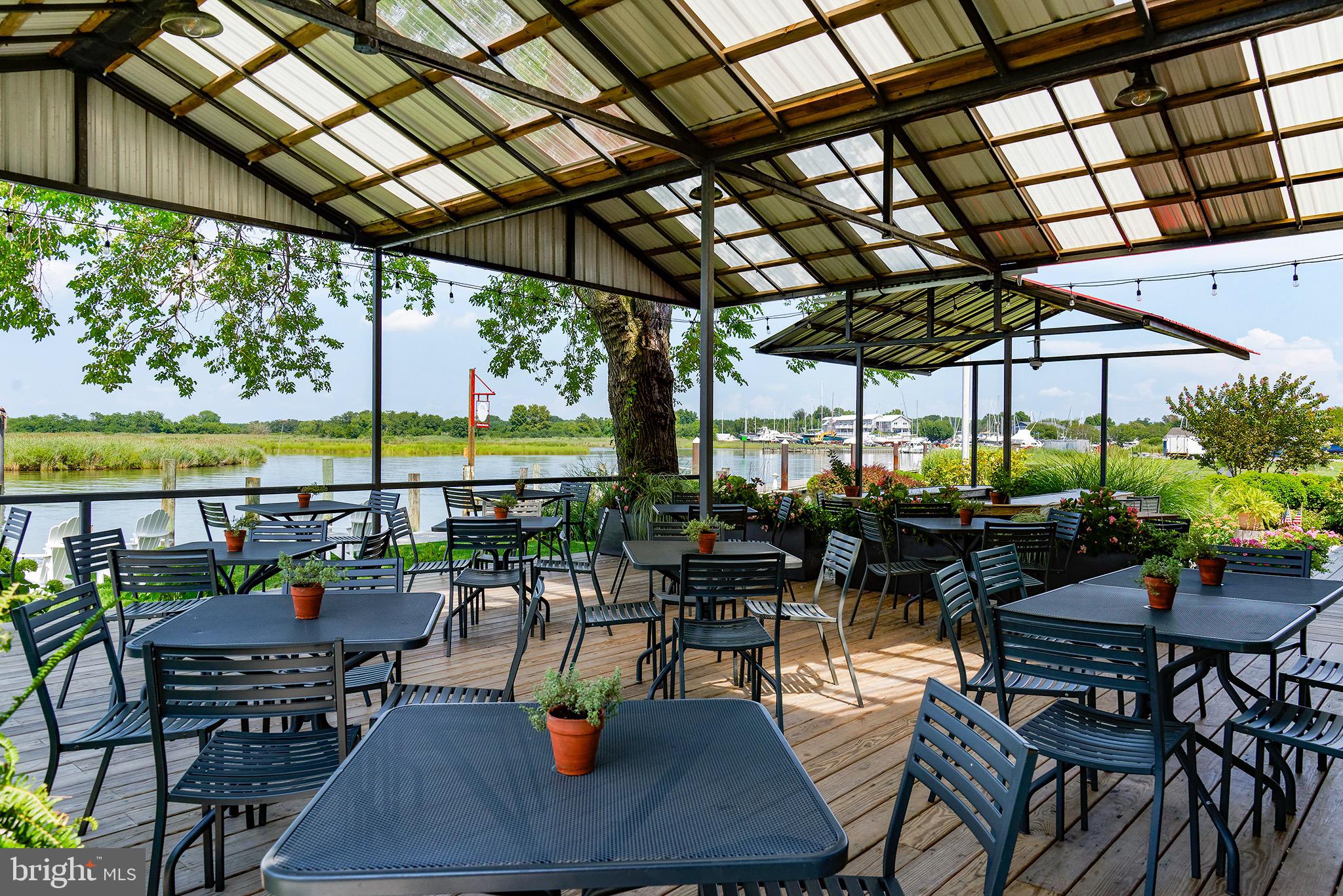 21384 Coopertown Road Tilghman, MD 21671 - Photo 13 of 25 Waterfront dining outside