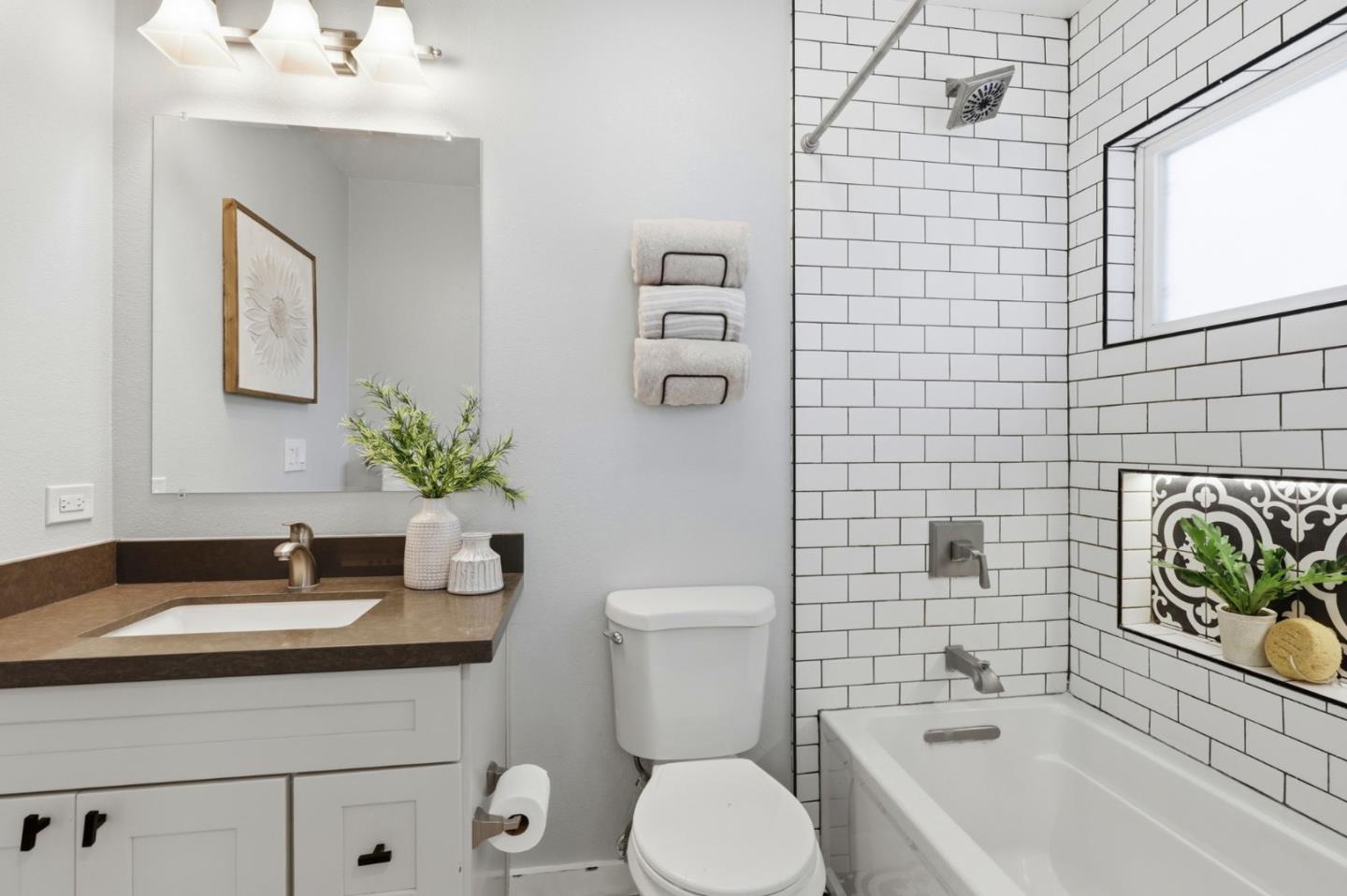 140 Second Street Gilroy, CA 95020 - Photo 26 of 33 a bathroom with a sink a toilet and mirror