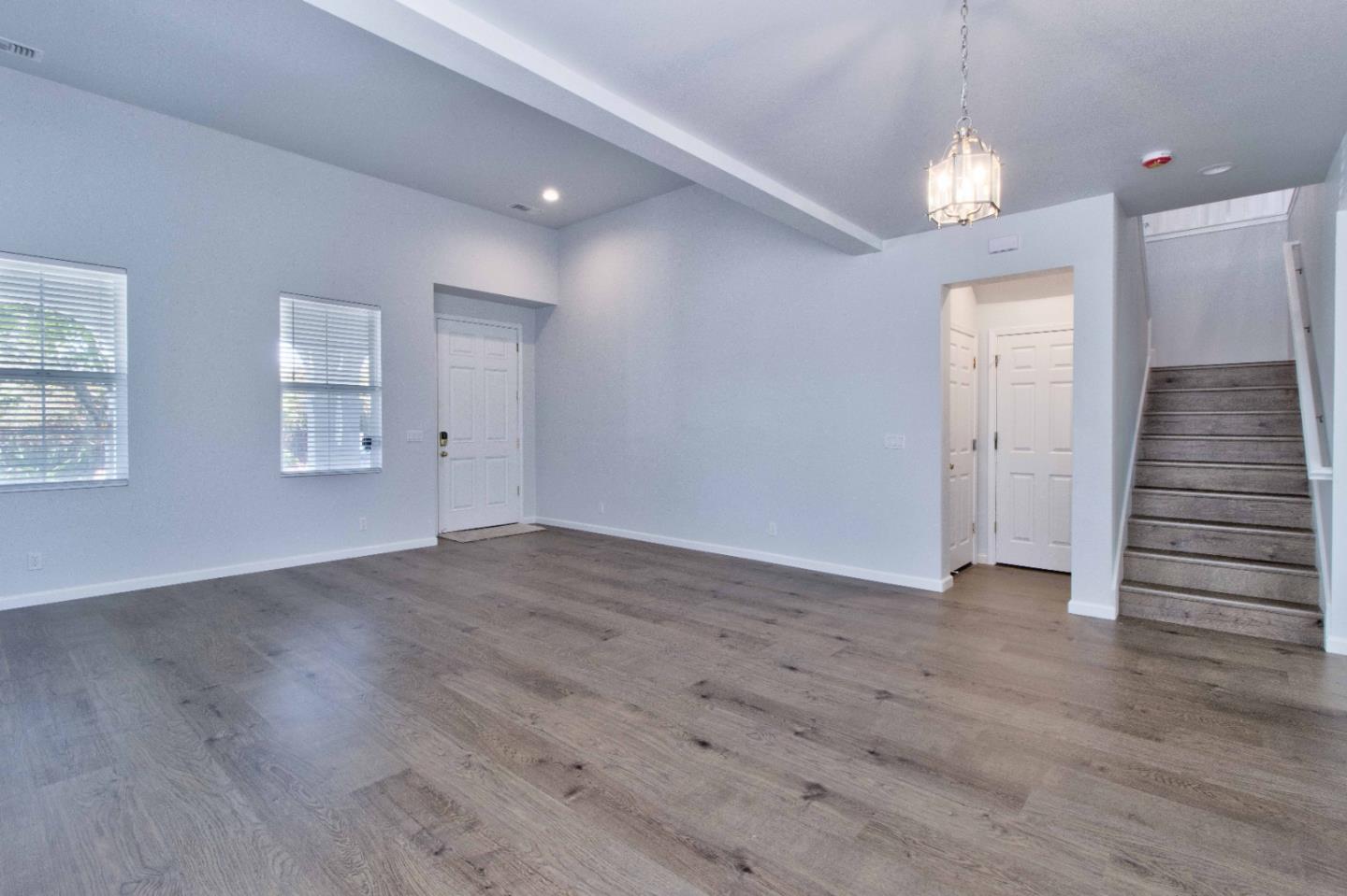 2715 Shellgate Circle Hayward, CA 94545 - Photo 7 of 47 an empty room with wooden floor and staircase
