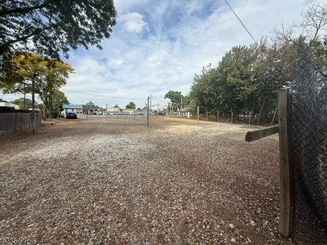 a view of outdoor space with playground and green space
