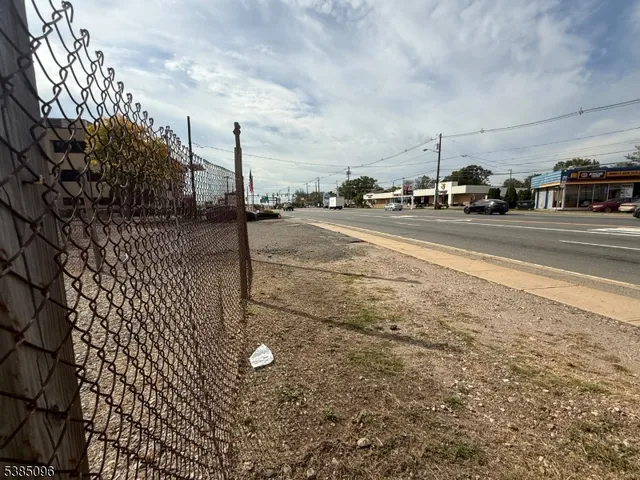 a view of street with parked cars