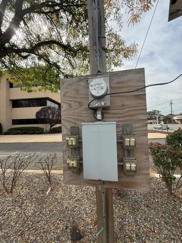 a view of dirt yard with a tree